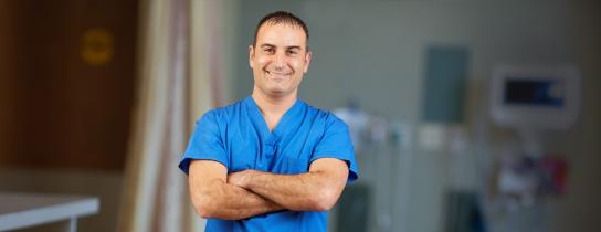 Vascular surgeon Dr. Fiorianti standing with arms folded