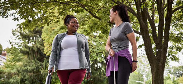 two women walking outdoors