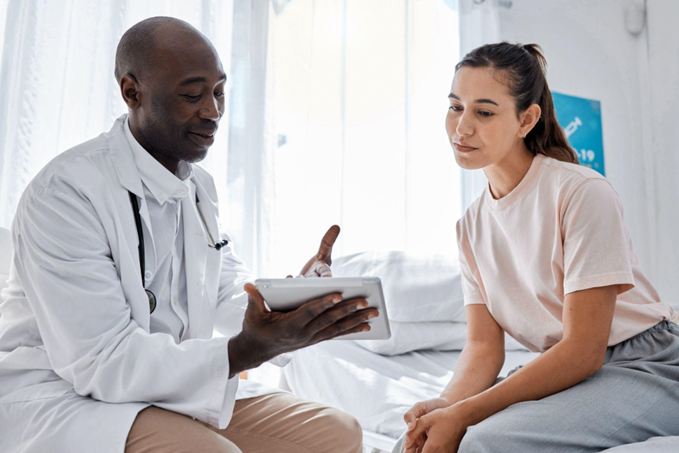 woman consulting with doctor or medical healthcare worker