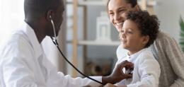 male-pediatrician-hold-stethoscope-exam-child-boy-patient