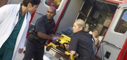 paramedics-and-doctor-unloading-patient-from-ambulance