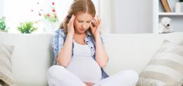 pregnant-woman-with-a-headache-and-pain