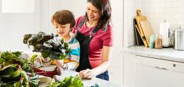 Parent and child preparing a healthy meal