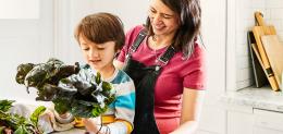 Parent and child preparing a healthy meal