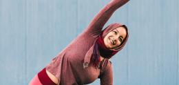 woman stretching arm