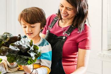 Parent and child preparing a healthy meal