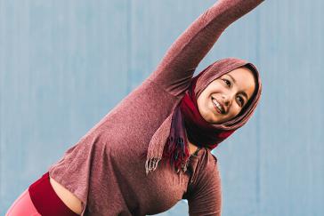 woman stretching arm