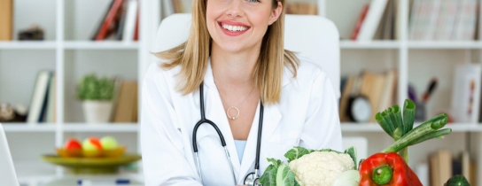 beautiful-smiling-nutritionist-looking-at-camera