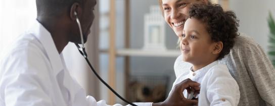 male-pediatrician-hold-stethoscope-exam-child-boy-patient