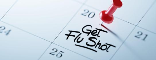 the-words-get-flu-shot-written-on-calendar-with-a-red-push-pin
