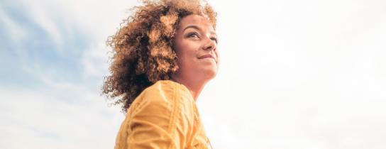 A woman enjoys a walk outdoors