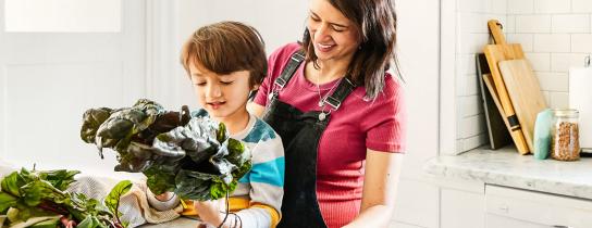 Parent and child preparing a healthy meal