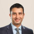 A photo of Hiren Patel, MD wearing a suit.