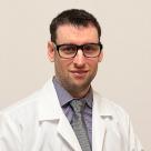 A photo of Allen Weiss, DO smiling in a lab coat