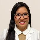 A photo of Annabel Yuen, MD smiling in a lab coat